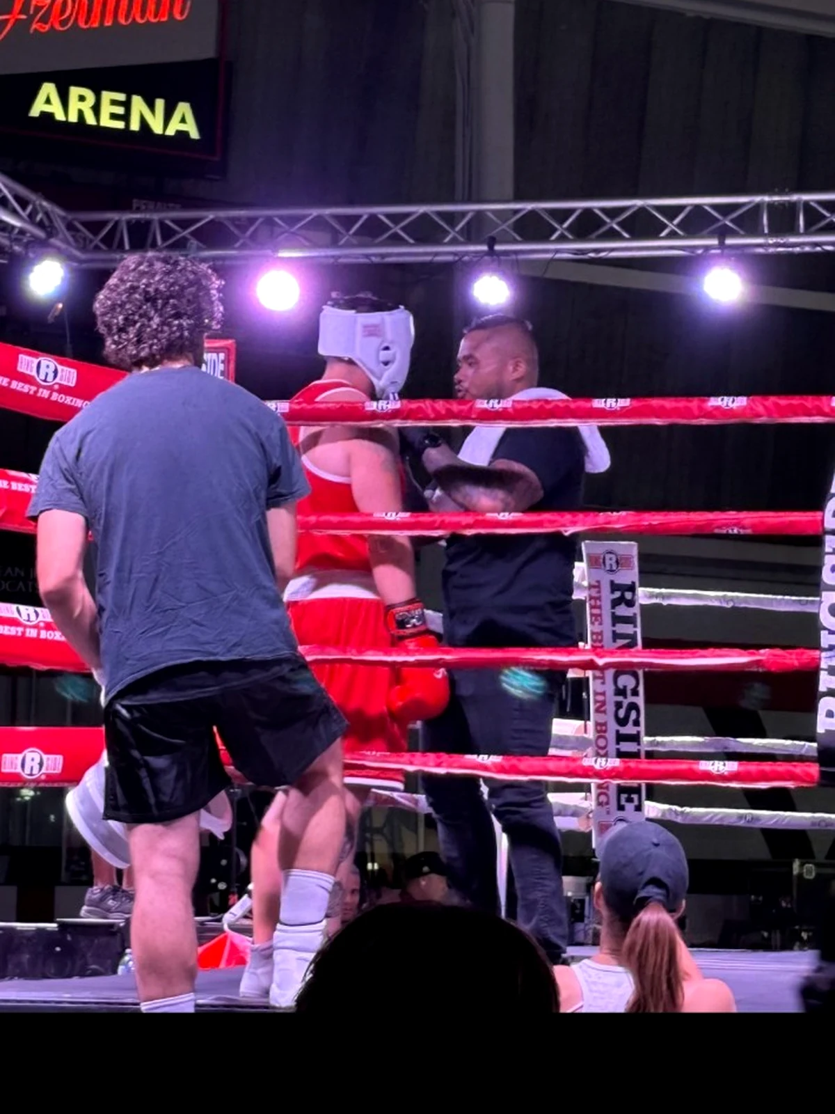 Coach Tony coaching from the corner during a boxing event