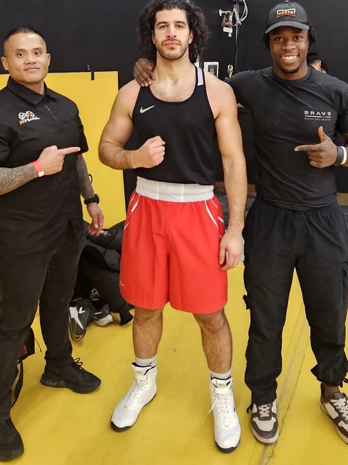 Coach Tony with a boxer and teammate after competition