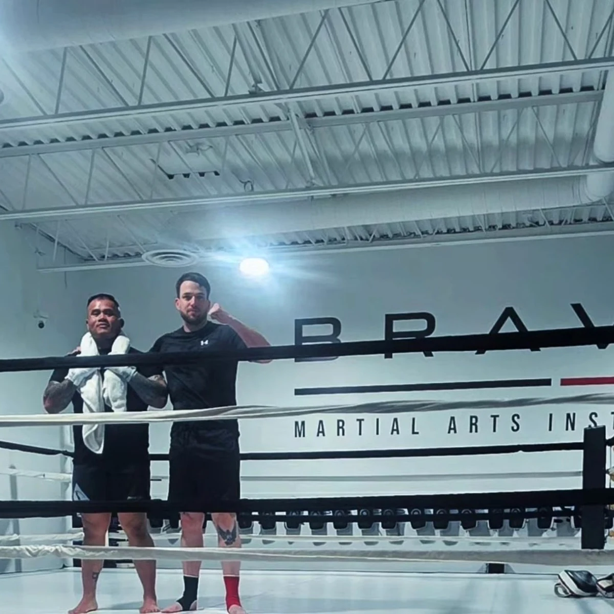 Coach Tony with a boxer standing in the ring