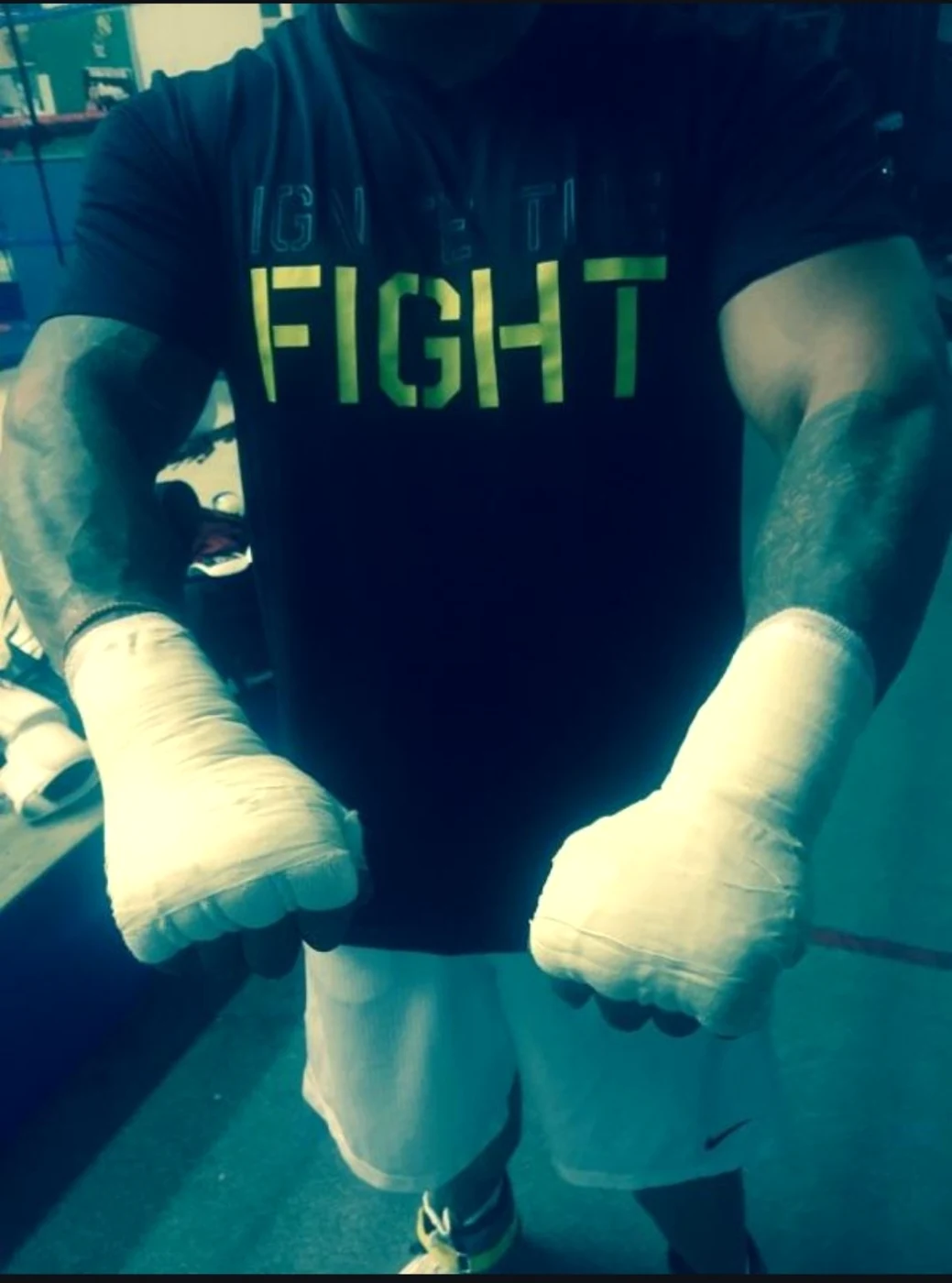 Coach Tony with wrapped hands preparing for training